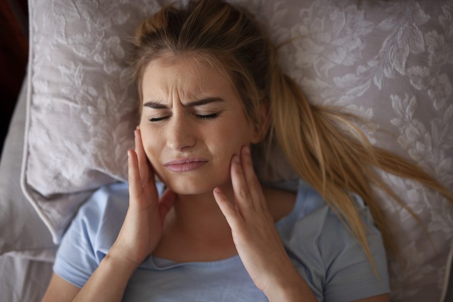 Why Grinding Your Teeth Is Destroying Your Dental Crowns & What Chicago Patients Can Do